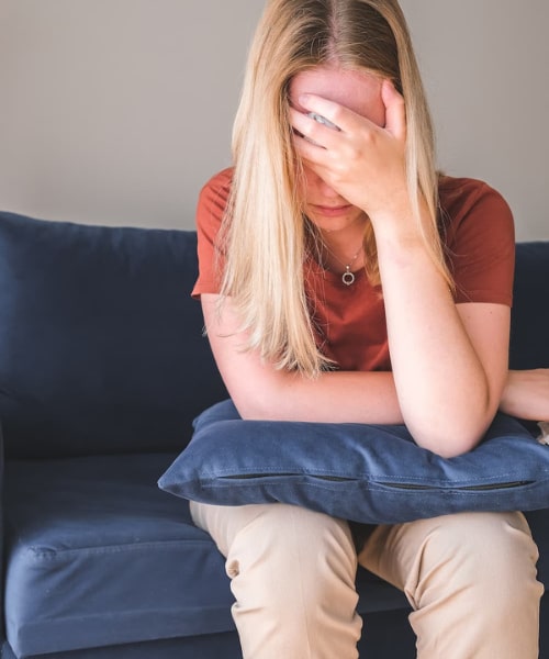 A woman who is experiencing fatigue and need fatigue treatment