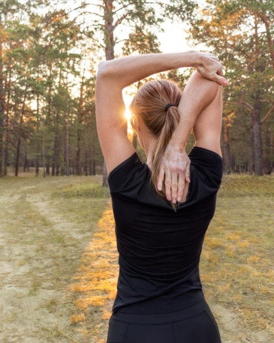 Woman having an outdoor exercise. Health and wellness concept.