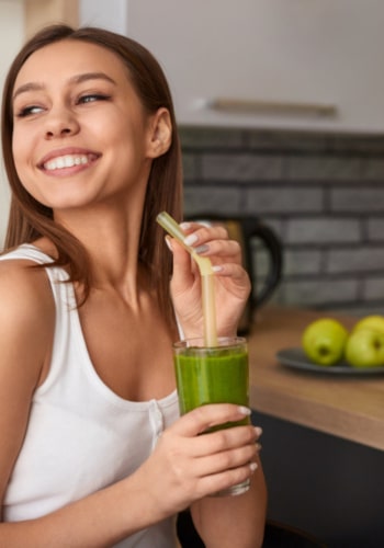 Young woman drinking - detox therapy in spring texas