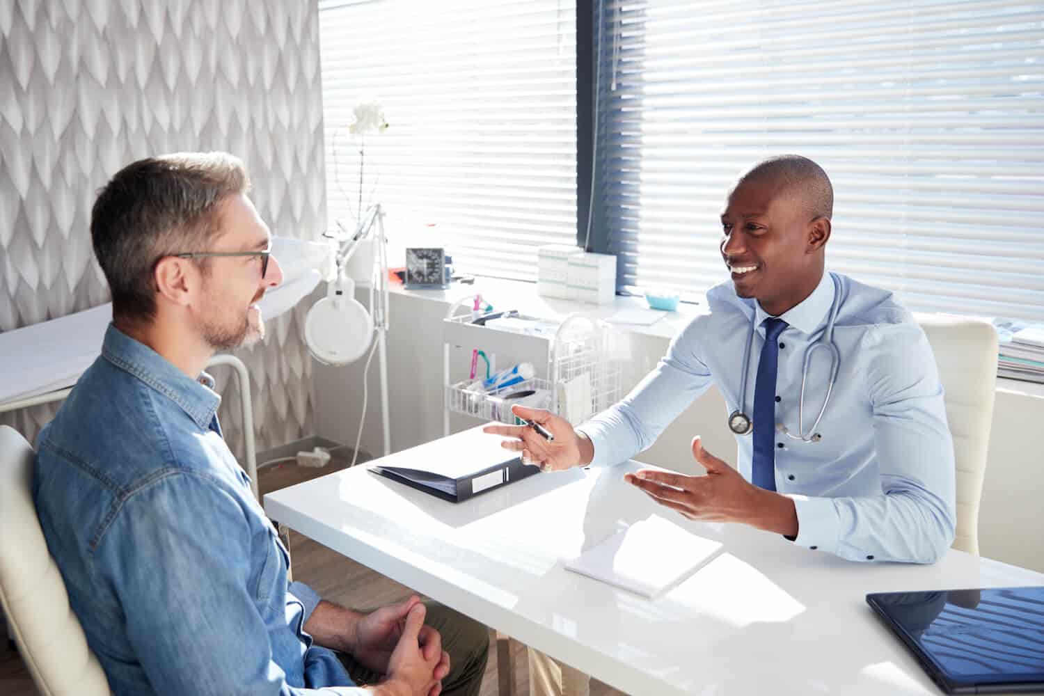 Mature male patient in consultation with a doctor
