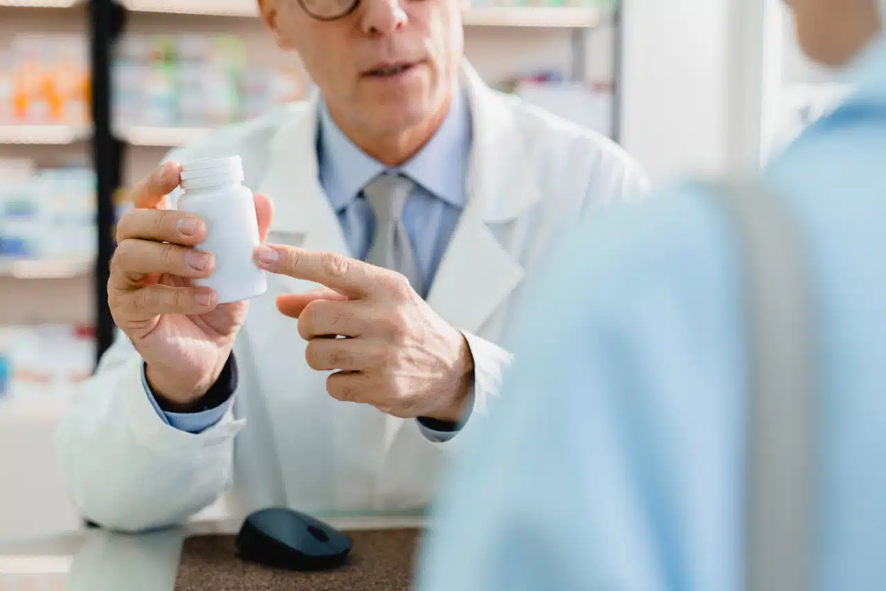 Pharmacist advising drugs.