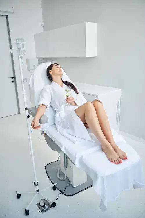 woman relaxing during iv drip vitamin therapy