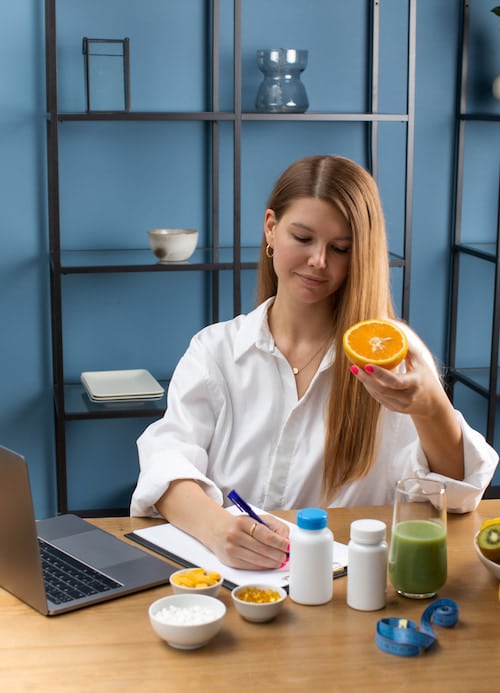 certified professional providing prescription to client for customized vitamin and weightloss plan