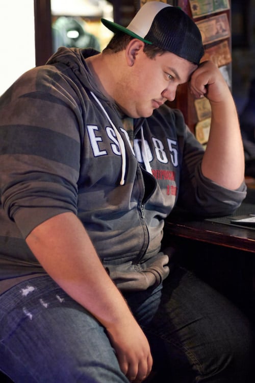 man with hormonal imbalance experiencing fatigue and depression