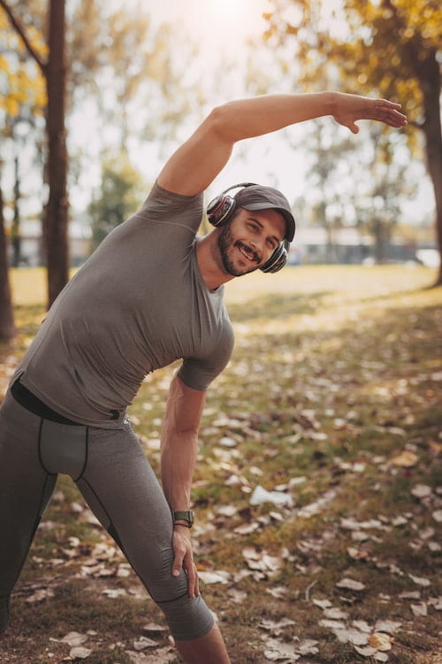 man experiencing high energy level and enhanced muscle mass after hrt therapy for  men