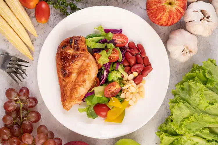 palm sized chicken in a bowl with mixed vegetables