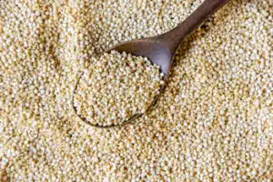 quinoa scooped with wooden spoon