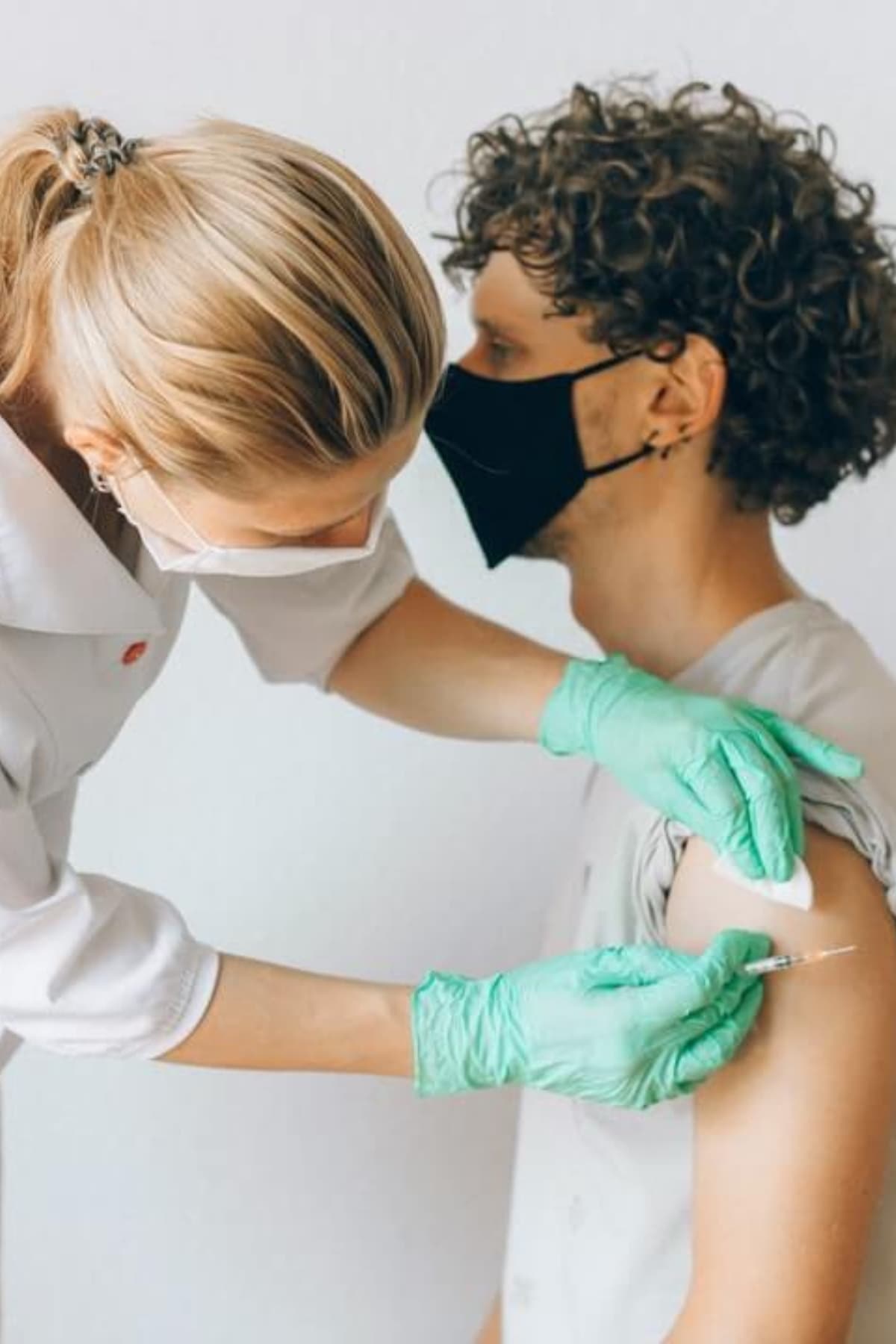 A doctor giving an man with a testosterone injection