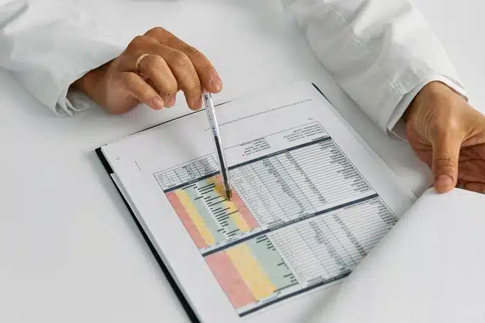 Doctor Hands Holding Notepad and Pen