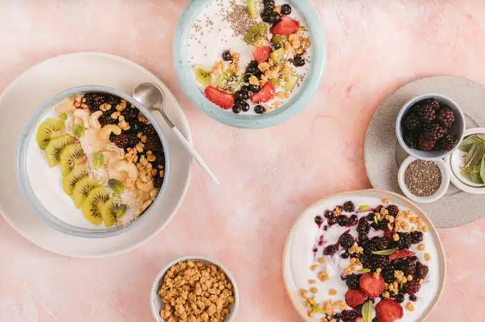 Nutritional diet with Sliced Fruits and Nuts in Ceramic Bowls